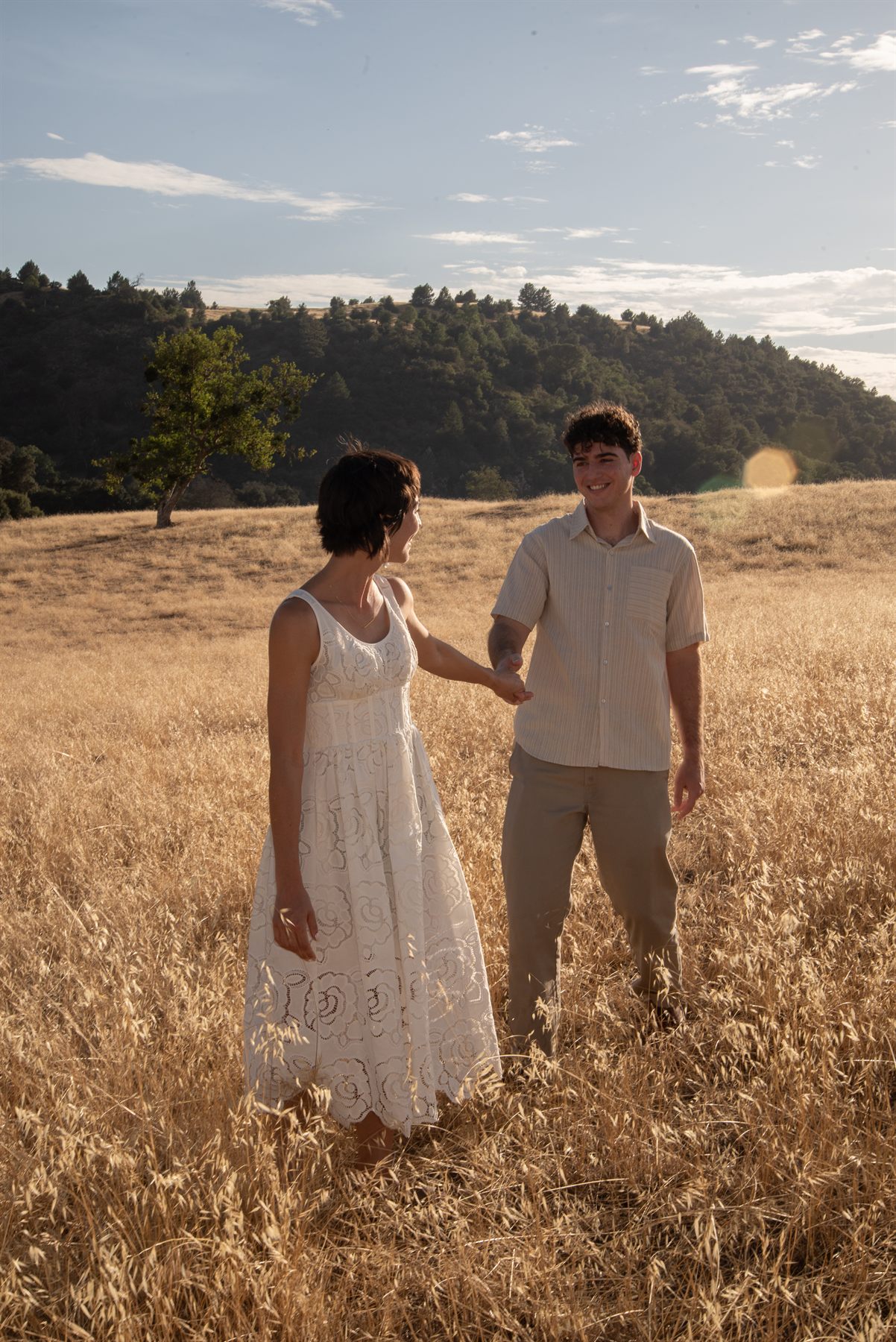 Holding hands in the tall grass